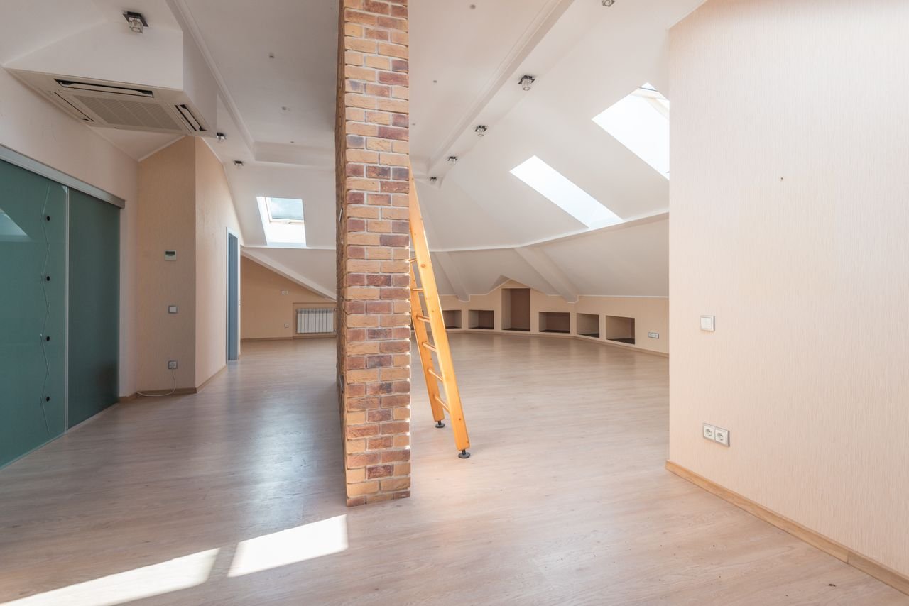 Modern loft bedroom with skylight