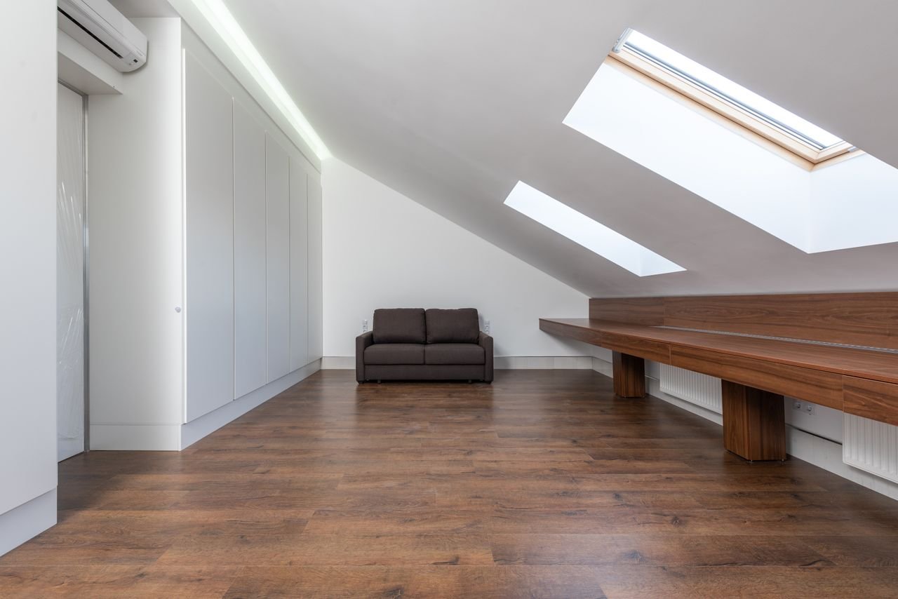 Bright loft conversion bedroom with roof windows